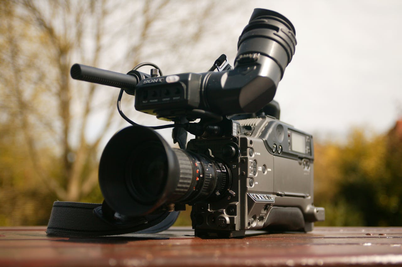 why-choose-us High-quality broadcast camera set outdoors, ideal for media and videography projects.